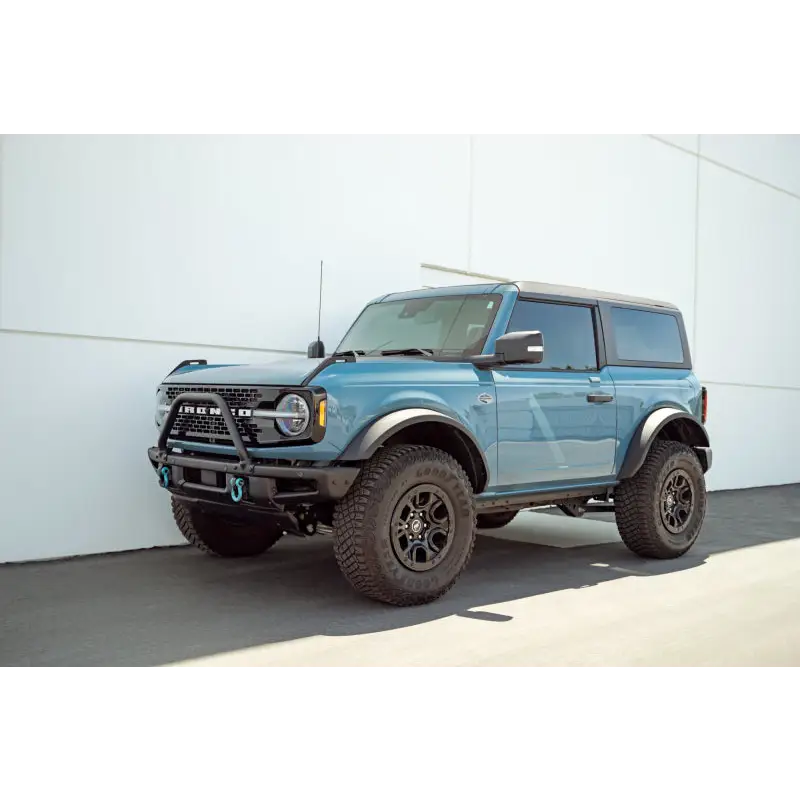 Blue Truck parked in front of a building - DV8 Offroad Pinch Weld Covers for Ford Bronco
