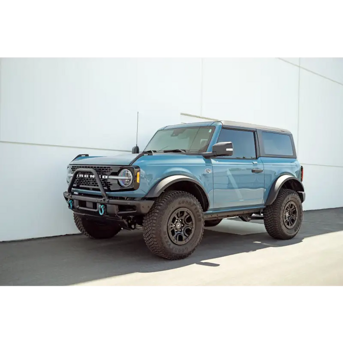 Blue Truck parked in front of a building - DV8 Offroad Pinch Weld Covers for Ford Bronco