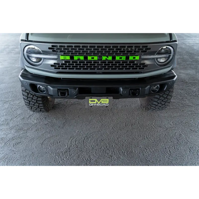 Green light truck with license plate mount on DV8 Offroad Ford Bronco Bumper.