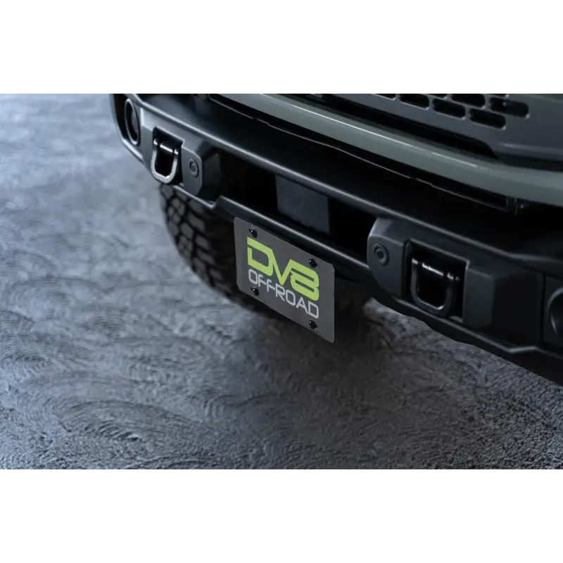 Close up of black truck bumper plate license plate mount.