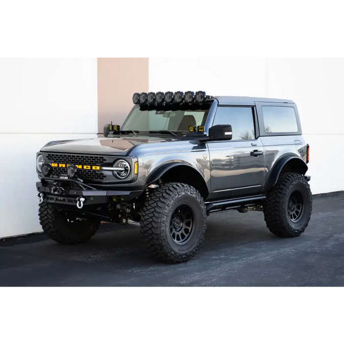 DV8 Offroad 21-23 Ford Bronco Rock Sliders with Light Bar and Large Tire