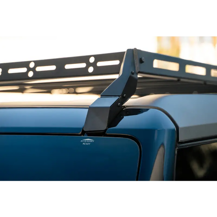 DV8 Offroad 21-23 Ford Bronco Hard Top Roof Rack with Light Bar Mount on Blue Car