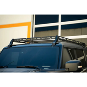 DV8 Offroad 21-23 Ford Bronco Hard Top Roof Rack with black roof rack on blue car