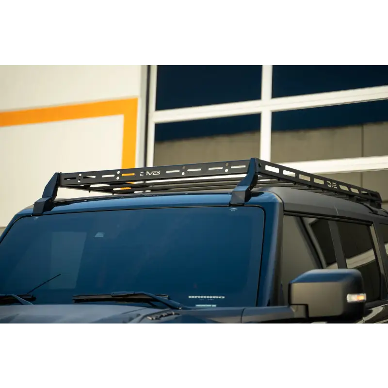 DV8 Offroad 21-23 Ford Bronco Hard Top Roof Rack with black roof rack on blue car