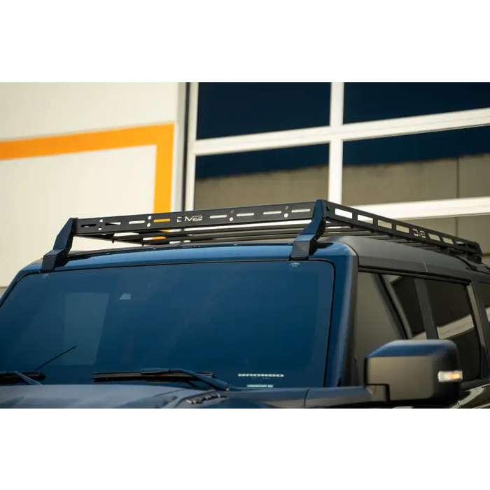 DV8 Offroad 21-23 Ford Bronco Hard Top Roof Rack with black roof rack on blue car