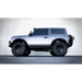 Silver offroad truck with big tire - DV8 Offroad 21-23 Ford Bronco OE Plus 2-Door Side Steps.