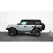 Gray Jeep parked in front of white wall with DV8 Offroad 21-23 Ford Bronco Pinch Weld Covers.