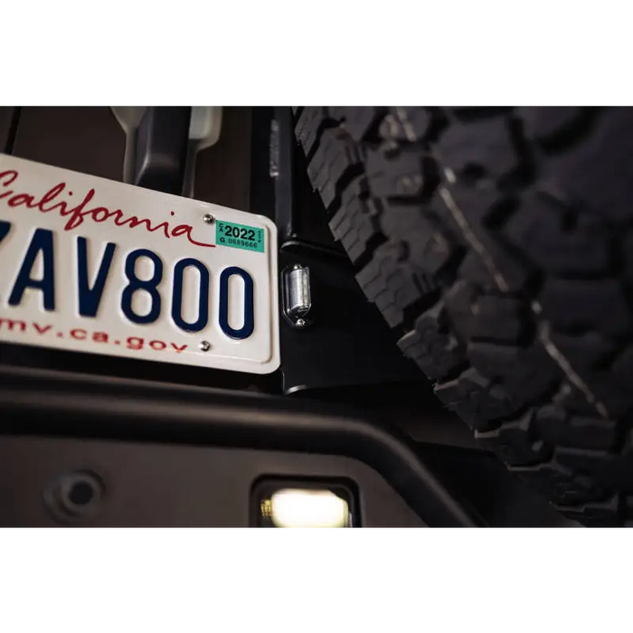California license plate on DV8 Offroad 21-23 Ford Bronco Rear License Plate Relocation Bracket.