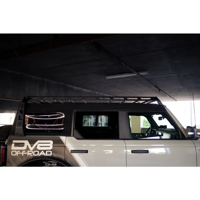 DV8 Offroad white truck with black roof rack for Ford Bronco Soft Top with light bar mount.