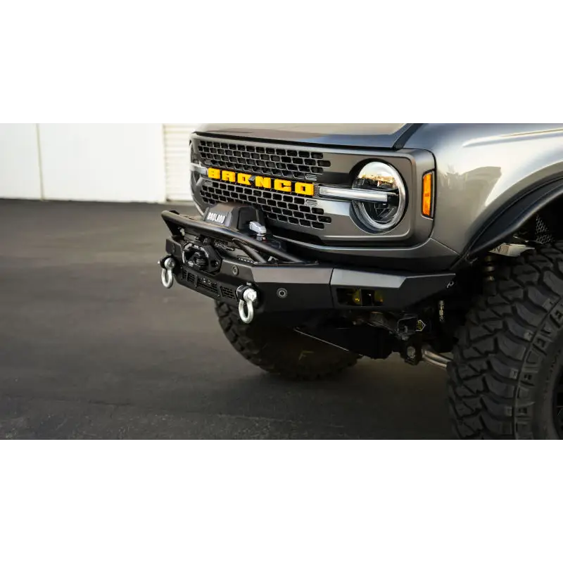 DV8 Offroad silver truck front bumper bar with skid plate and light bar, Spec Series.