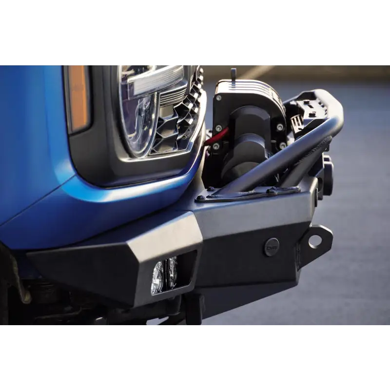 Blue Ford Bronco front bumper with open door by DV8 Offroad - Spec Series design with skid plate and light bar.