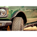 Green truck with light - DV8 Offroad Ford Bronco fender flares.