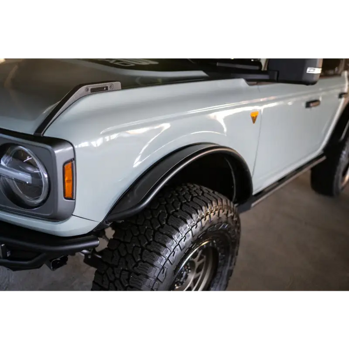 White truck with black hood and bumper - DV8 Offroad 21-23 Ford Bronco Tube Fender Flares.