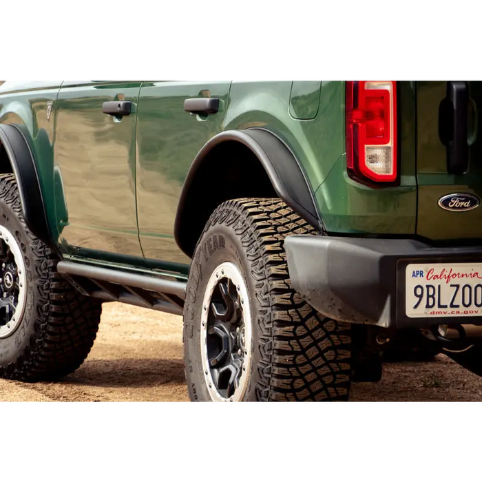 Green truck with license plate, DV8 Offroad Ford Bronco Tube Fender Flares