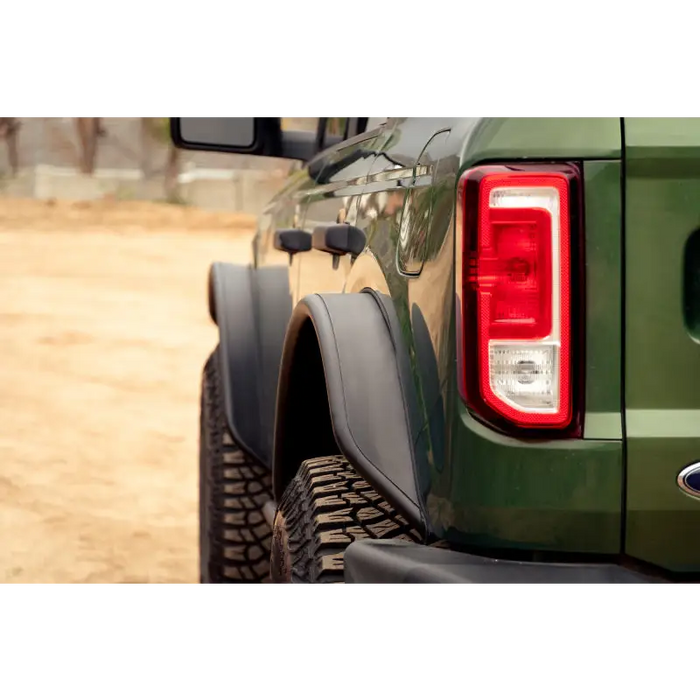 Green truck with red tail light, DV8 Offroad Ford Bronco Tube Fender Flares