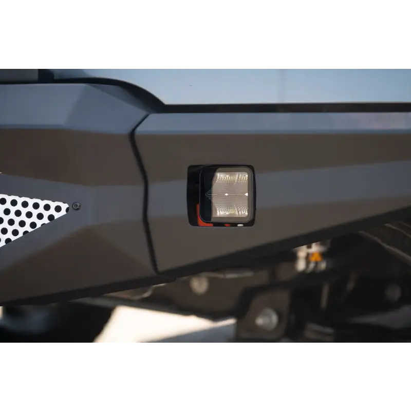 Close up of DV8 Offroad Elite Series 3in Cube LED Light with front light on motorcycle