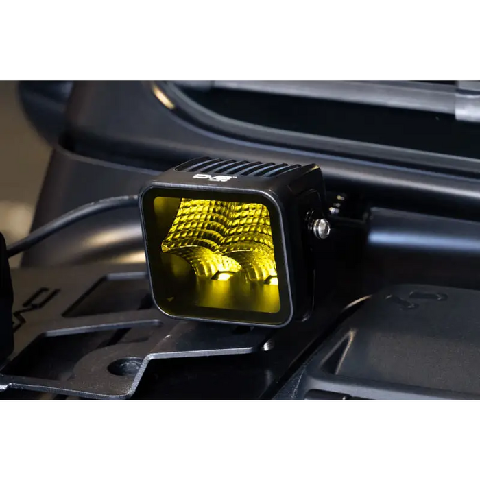 Close up of yellow Elite Series LED Amber Pod Light on a motorcycle