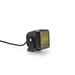 DV8 Offroad 3in Elite Series LED Amber Pod Light on a black car rear view mirror with yellow light