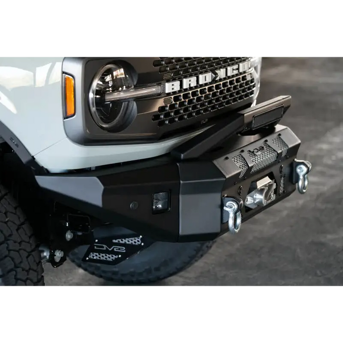 White truck front bumper bar add-on from DV8 Offroad for Ford Bronco bumpers with 13in Elite Series light bar.