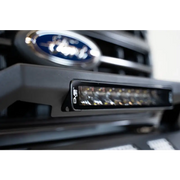 Close up of Ford logo on car grille in DV8 Offroad Elite Series 13in Light Bar.