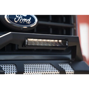Close up of Ford logo on a truck grille showcasing DV8 Offroad Elite Series lights