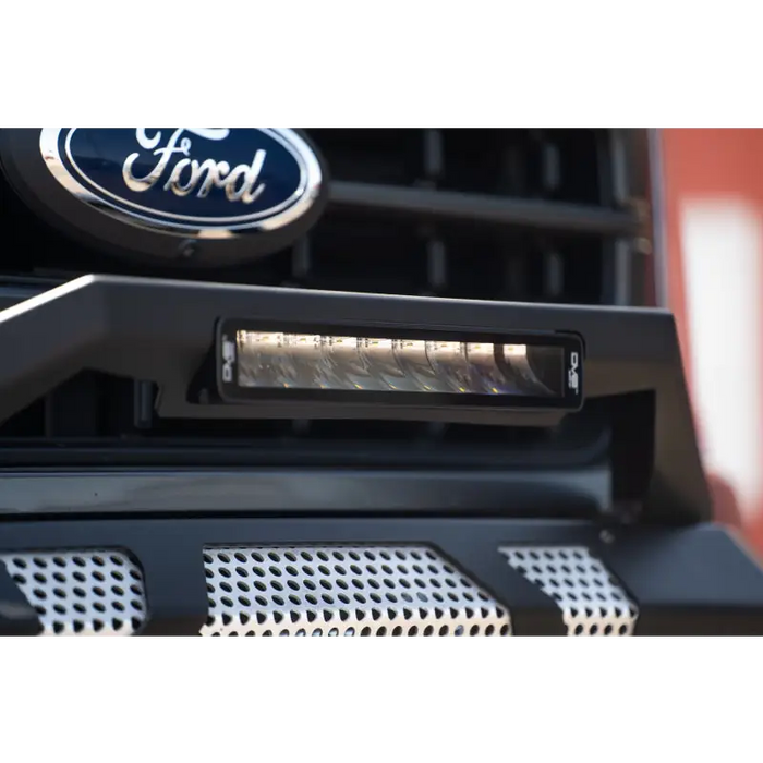 Close up of Ford logo on a truck grille showcasing DV8 Offroad Elite Series lights