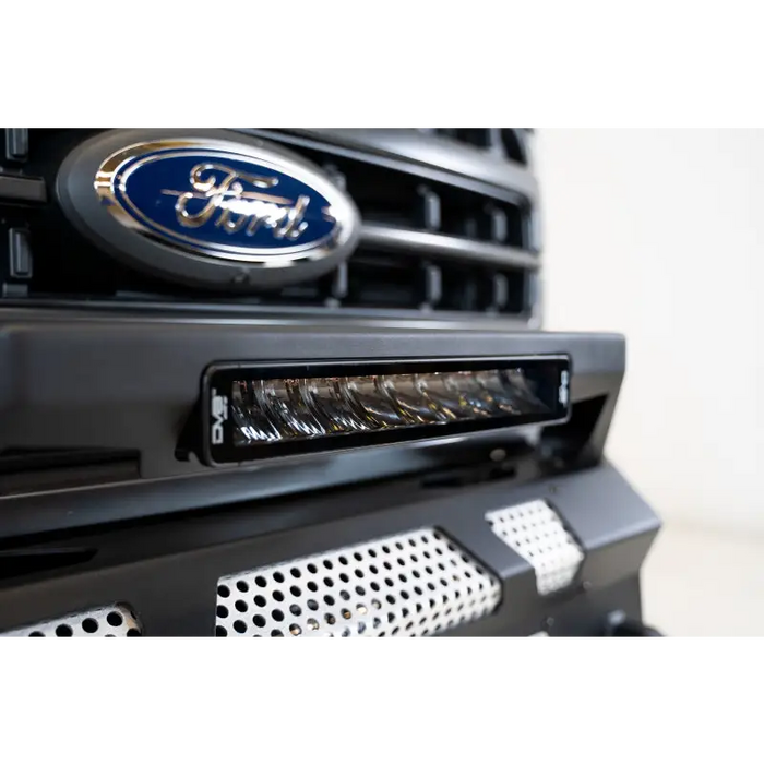 Close up of Ford logo on vehicle grille with DV8 Offroad Elite Series lights.