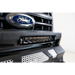 Close up of Ford logo on vehicle grille with DV8 Offroad Elite Series lights.