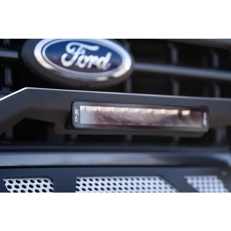 Ford F-150 front bumper bar with DV8 Offroad Elite Series 13in light bar.