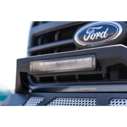 Close up of Ford logo on truck grille on DV8 Offroad Elite Series lights