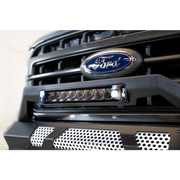 Close up of Ford truck grill with blue Ford logo on DV8 Offroad Elite Series 13in Light Bar 45W Flood/Spot LED.