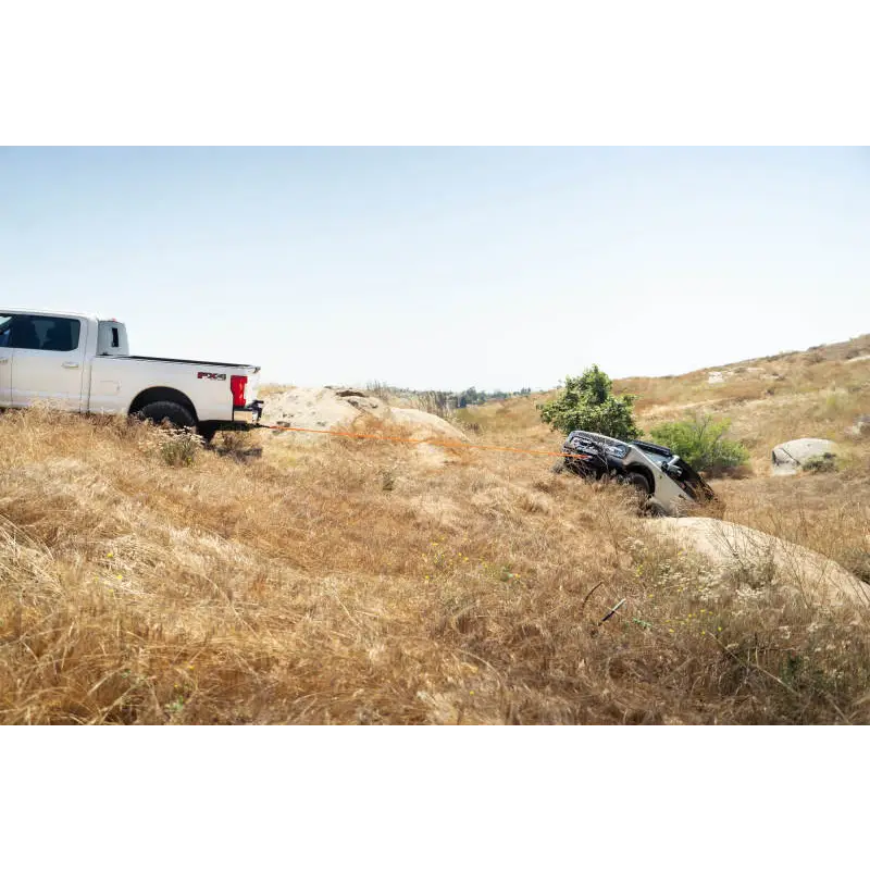 DV8 Offroad Elite Series D-Ring Shackles - Pair (Black) on hill with truck in background