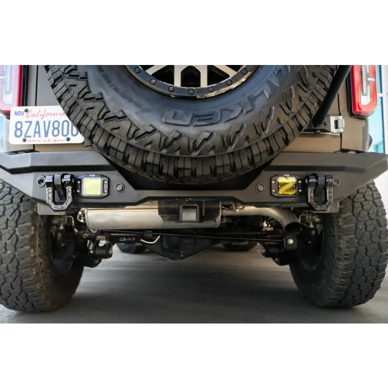 Black DV8 Offroad Elite Series D-Ring Shackles parked in a garage