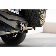 DV8 Offroad Elite Series D-Ring Shackles - Pair (Black) rear bumper plate close up.