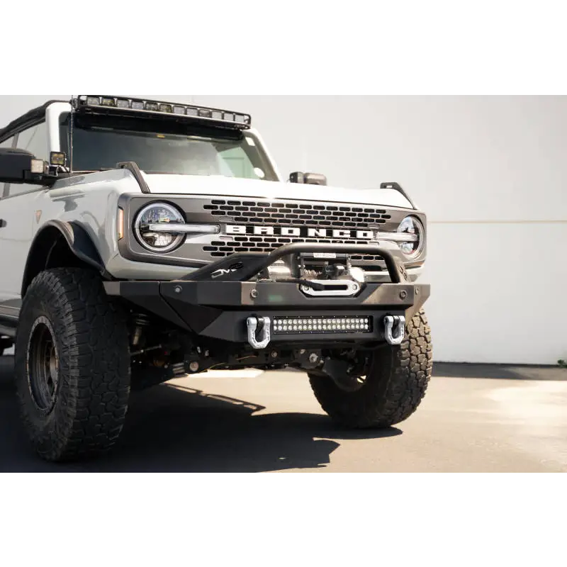 Gray DV8 Offroad Elite Series D-Ring Shackles in a parking lot