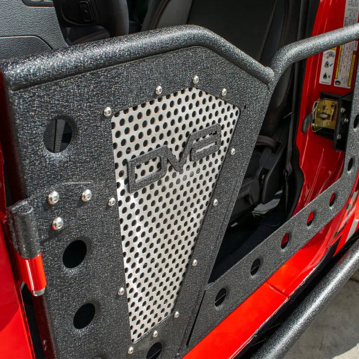 DV8 Offroad Jeep front rock doors with red jeep’s metal grill.