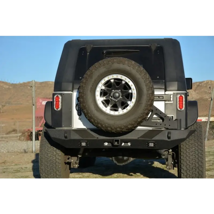 Black Jeep with Bumper Mounted Tire Carrier from DV8 Offroad RS-10/RS-11 TC-6