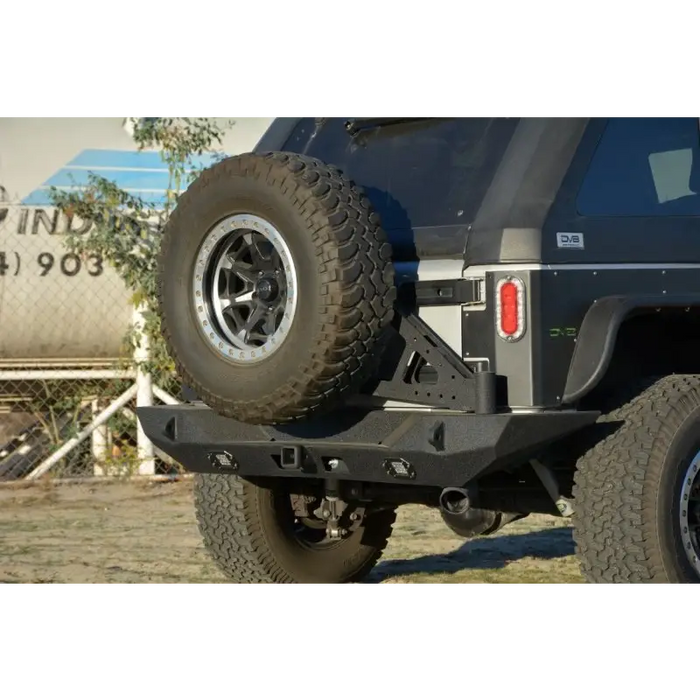 Offroad Jeep with DV8 Offroad RS-10/RS-11 TC-6 Bumper Mounted Tire Carrier