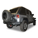DV8 Offroad RS-10/RS-11 TC-6 bumper mounted tire carrier with jeep tire.