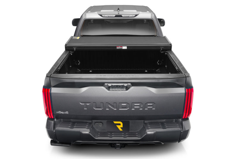 Gray 2019 rambo truck rear view displayed in extang solid fold alx for toyota tacoma bed
