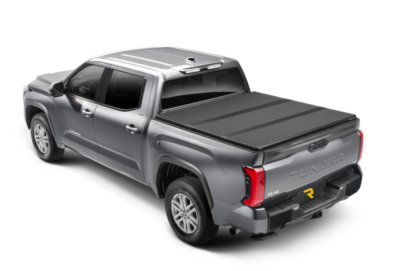 Black extang solid fold alx truck bed cover for 16-23 toyota tacoma with 5ft. 1in. Bed
