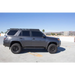 Gray Toyota SUV parked in a parking lot beside Go Rhino 10-23 Toyota 4Runner Ceros Low Profile Roof Rack.