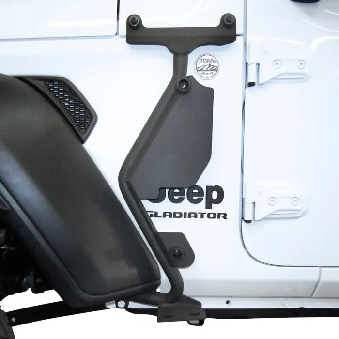 Front view of white Jeep Wrangler with black seat - Go Rhino Exterior Jack Mount