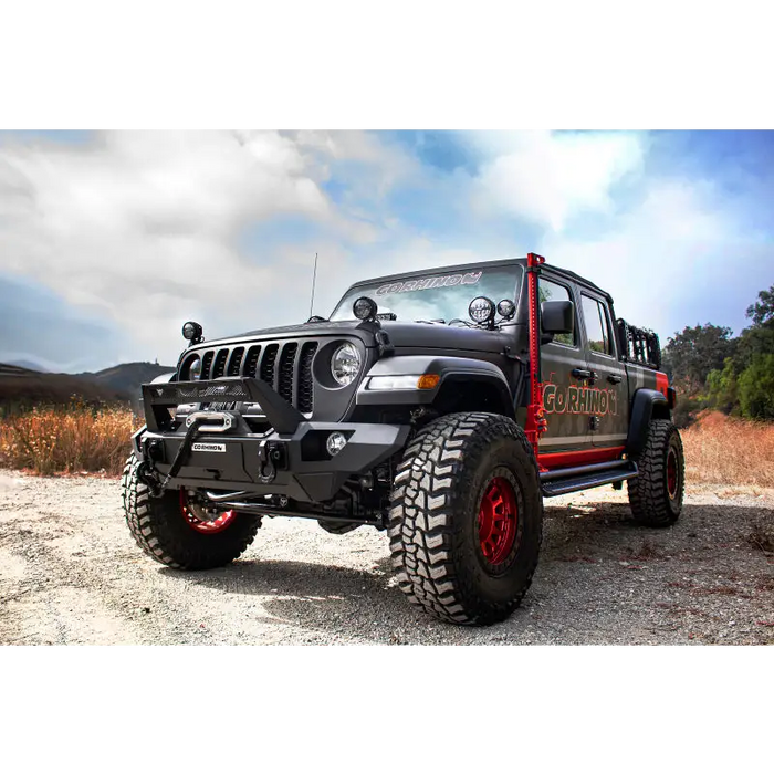 Black Jeep with red wheels and bumper - Go Rhino Exterior Jack Mount for Jeep Wrangler & Gladiator