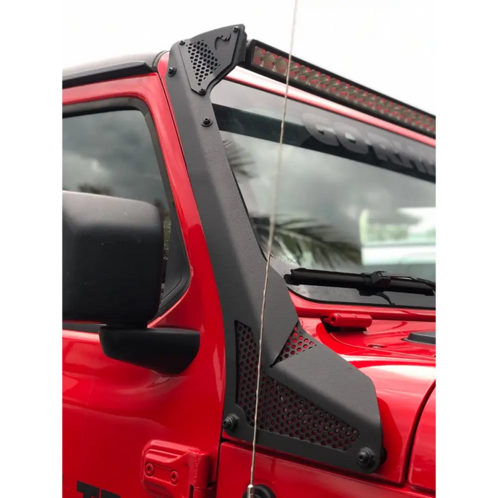 Red jeep with black roof rack featured in Go Rhino Jeep Wrangler windshield light bar mount.