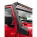 Red jeep with black roof rack featured in Go Rhino Jeep Wrangler windshield light bar mount.