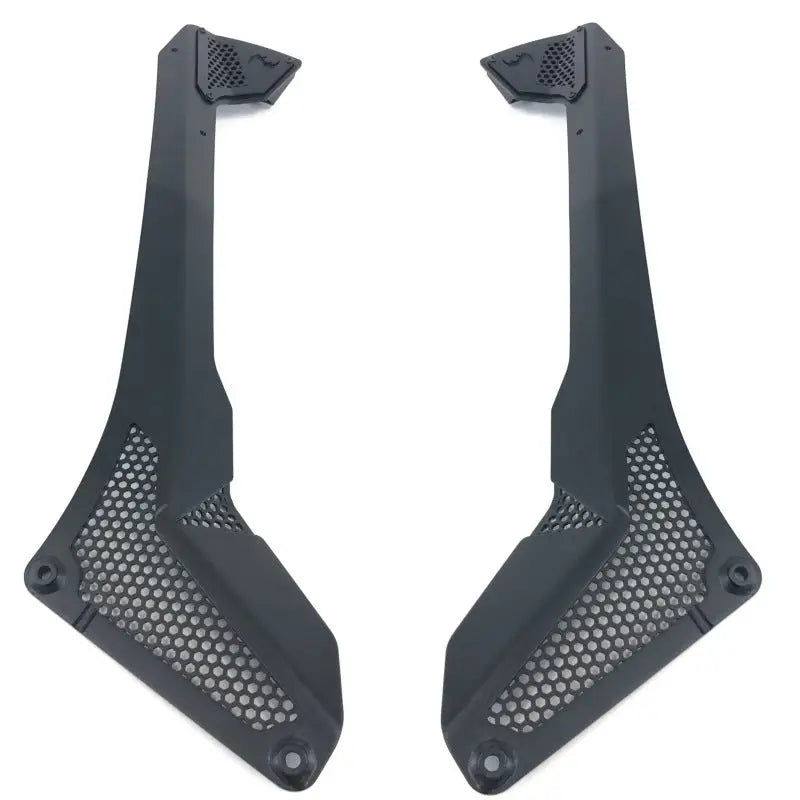 Black plastic front fender fenders for a BMW displayed on Jeep Wrangler windshield light bar mount.