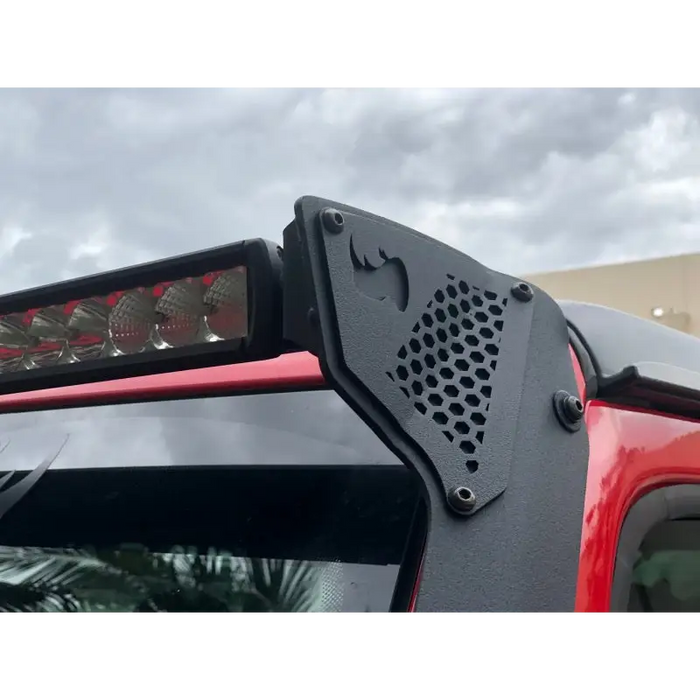 Red Jeep Wrangler with Black Grille Guard Windshield Light Bar Mount