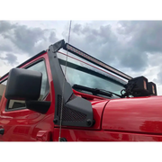 Red truck with black roof rack on Go Rhino Windshield Light Bar Mount for Jeep Wrangler.