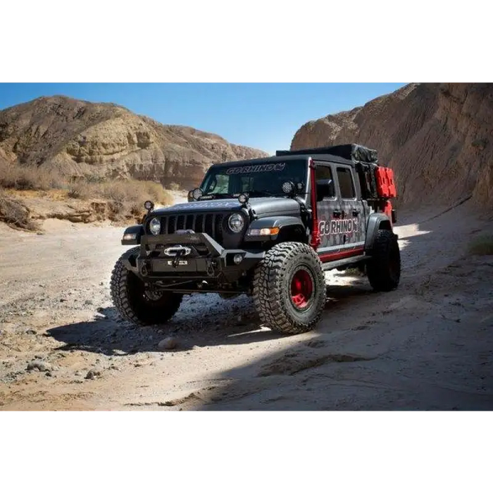 Jeep Gladiator with red tire cover: Go Rhino XRS Overland Xtreme Rack - Black.